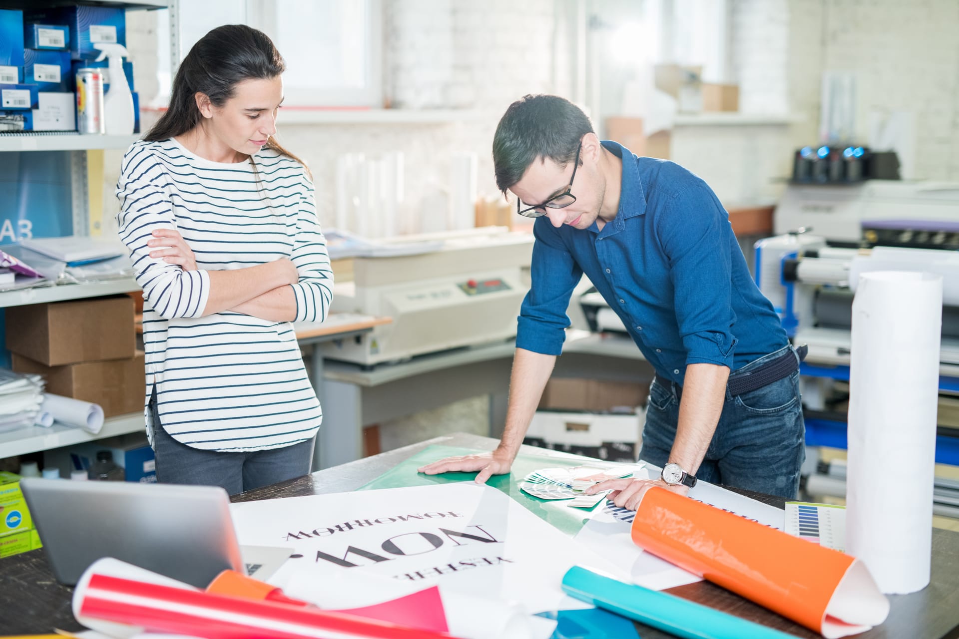 Banner being printed in an advertising company office